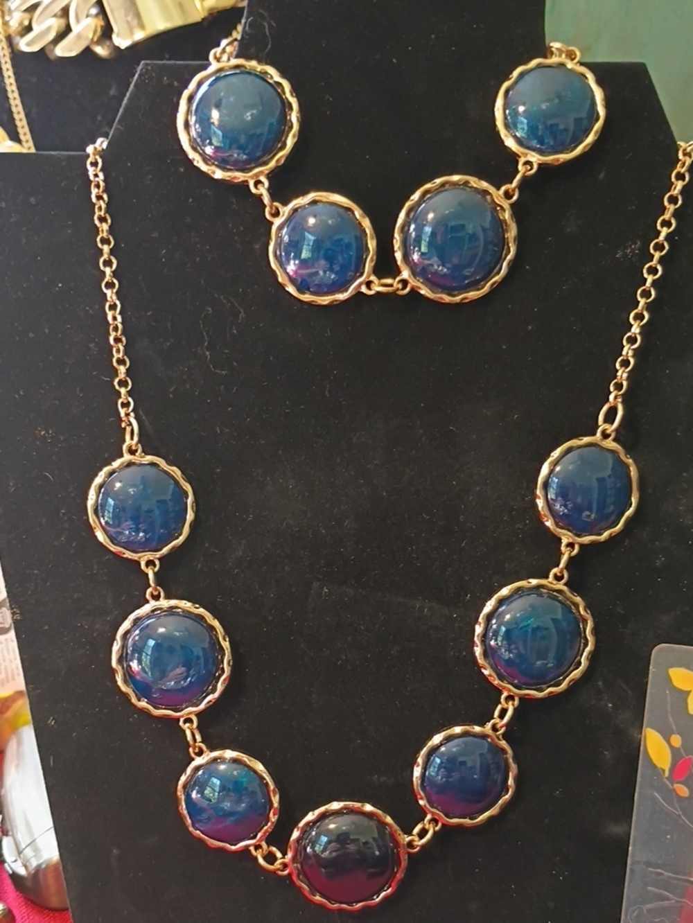 Gold Necklace with Deep Blue Cabochon Discs